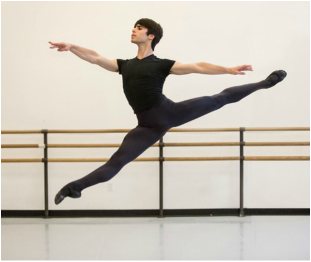 ballet student Ari Breitman mid-leap
